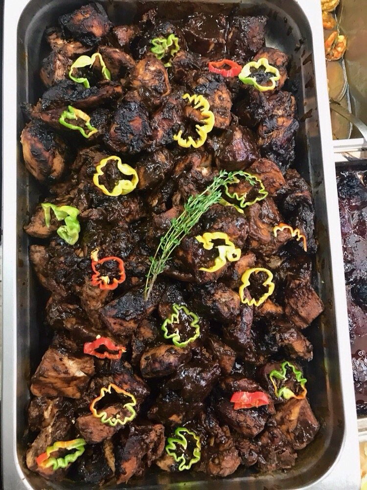 Island Cocina jerk chicken catering tray with peppers